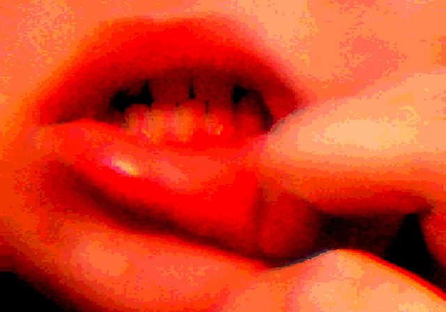 An edited GIF of Nicolae's teeth. It is mostly red, and Nicolae is pulling at their lower lip.